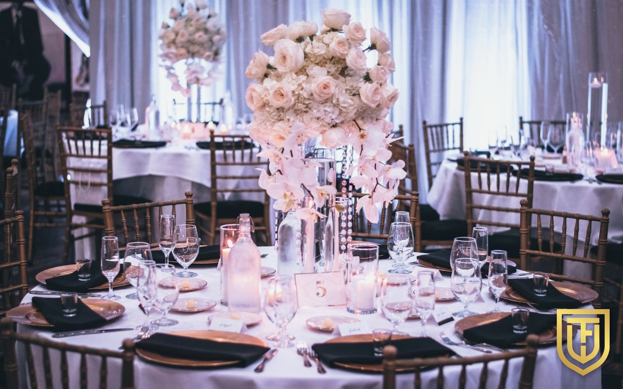 Elegant ballroom wedding reception with floral centerpieces