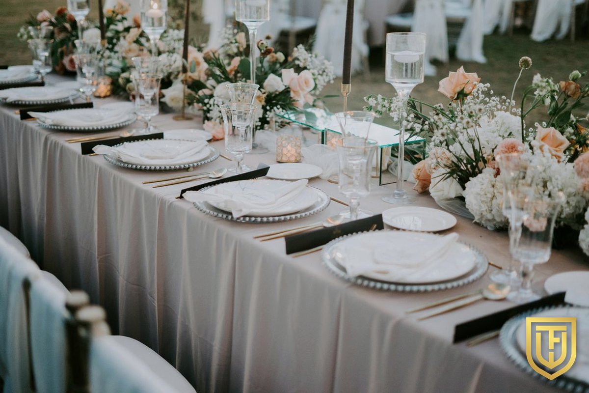 Long banquet table with peach florals
